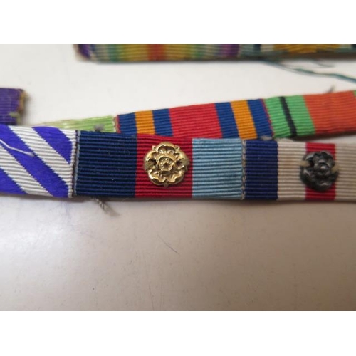 951 - Twenty medal ribbons WWI-WWII, all with emblems including one Battle of Britain rosette - mentioned ... 