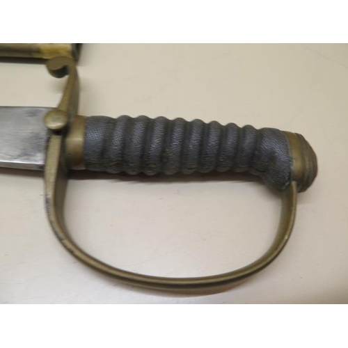 955 - A brass hilted Police or Customs hanger sword with shagreen grip and leather scabbard, blade length ... 