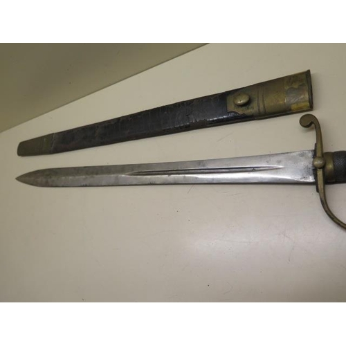 955 - A brass hilted Police or Customs hanger sword with shagreen grip and leather scabbard, blade length ... 