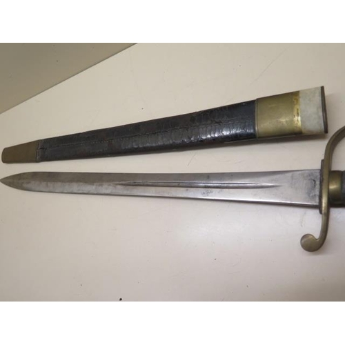 955 - A brass hilted Police or Customs hanger sword with shagreen grip and leather scabbard, blade length ... 