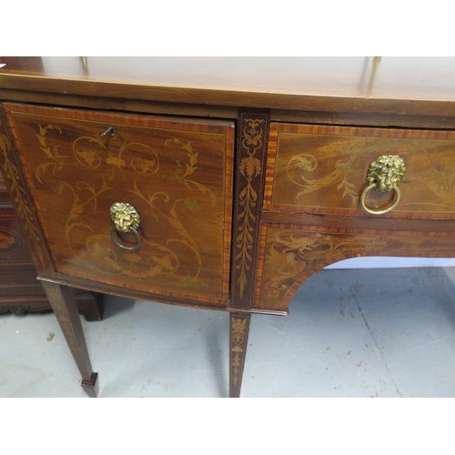 100 - A 19th century inlaid mahogany bowfronted sideboard with two drawers and a cupboard having a brass r... 