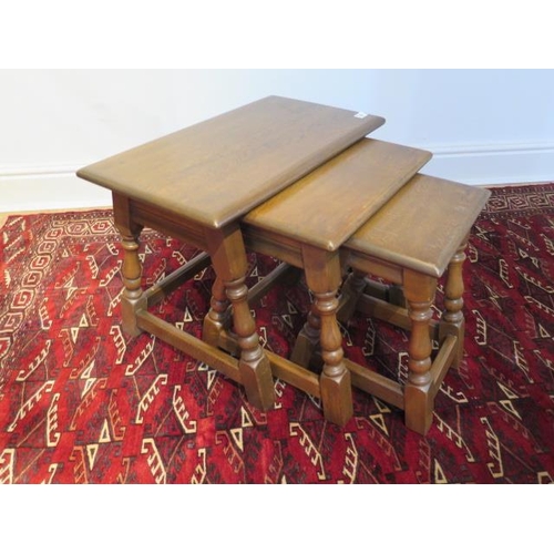 13 - A nest of three oak side tables