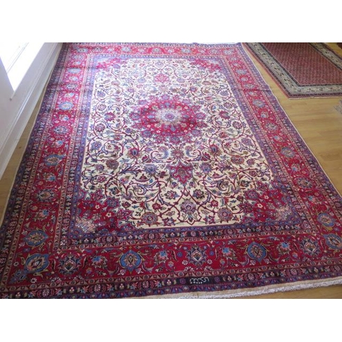 220 - A hand knotted woollen Meshed rug, 3.45m x 2.55m