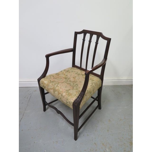 57 - A Sheraton style early 19th century mahogany armchair in polished condition