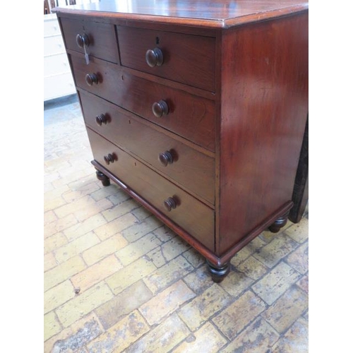 61 - An early Victorian chest of two over three graduated and oak lined drawers with bun handles on turne... 