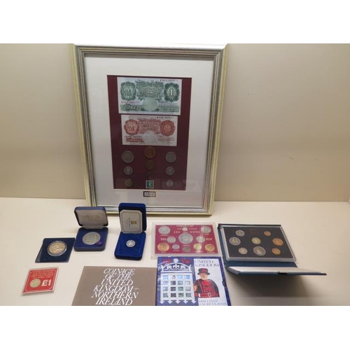 869 - A framed 1954 coin and banknote set and other coinage including four coin collections