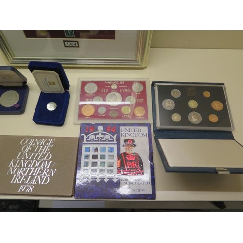 869 - A framed 1954 coin and banknote set and other coinage including four coin collections