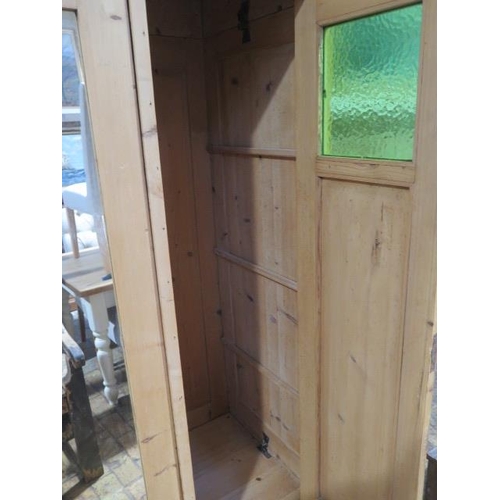 87 - A Continental stripped pine knock down three door wardrobe, disassembles for easy transport, 208cm t... 