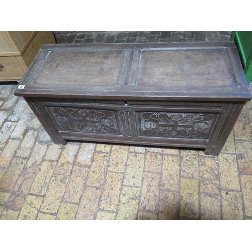 88 - An 18th century oak coffer with a carved two panel front, 52cm tall x 108cm x 42cm