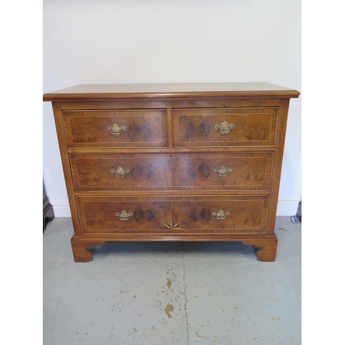 90 - A re-veneered restored early 1900's four drawer chest with star inlay on shaped bracket feet, 96cm t... 