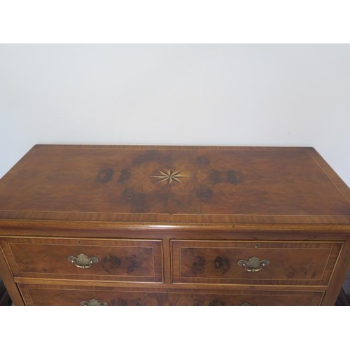 90 - A re-veneered restored early 1900's four drawer chest with star inlay on shaped bracket feet, 96cm t... 