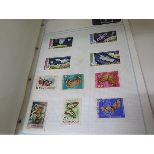 985 - Four stamp albums with World stamps