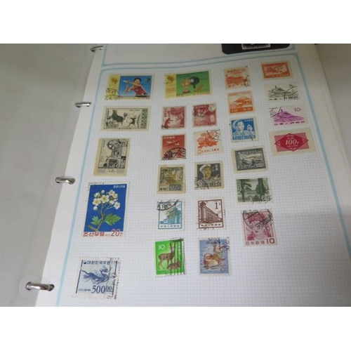 985 - Four stamp albums with World stamps