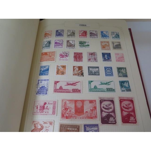 985 - Four stamp albums with World stamps