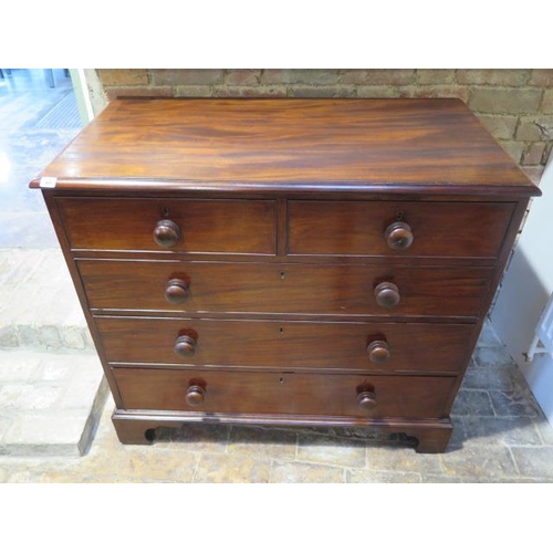 99 - A Georgian mahogany chest of two over three graduated and cockbeaded drawers, with bun handles stand... 