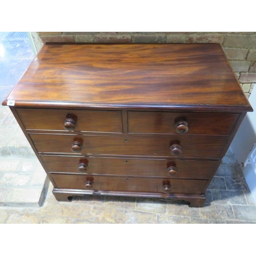 99 - A Georgian mahogany chest of two over three graduated and cockbeaded drawers, with bun handles stand... 