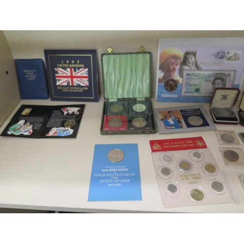 873 - A collection of assorted coins to include a boxed set of 24ct gold state quarters and a masonic silv... 