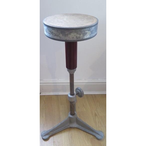 17 - An industrial aluminum revolving Jewellers stool adjustable in height on a triform base