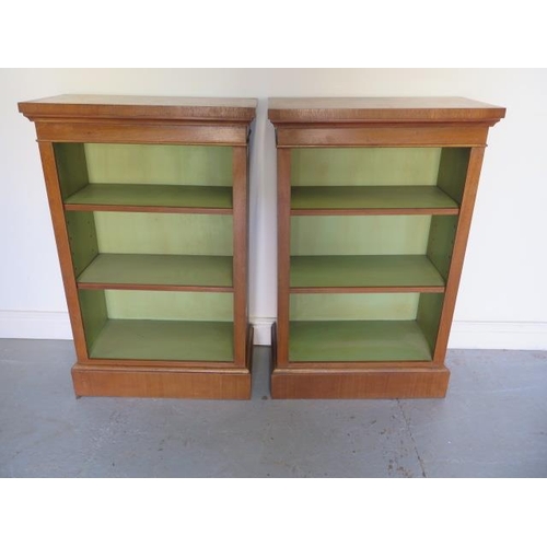 26 - A pair of new walnut bookcases with adjustable shelves and painted interior, made by a local craftsm... 