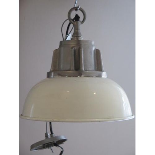 29 - An industrial style cream hanging ceiling lamp, 34cm diameter x 34cm tall