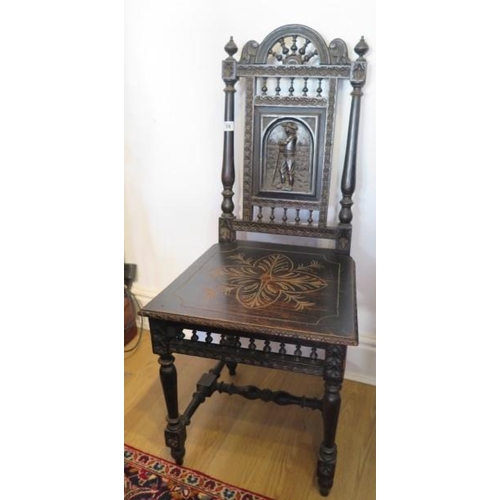 58 - A Victorian ebonised carved hall chair