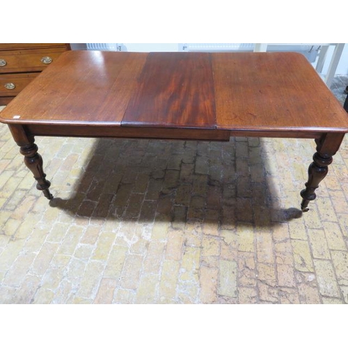 60 - A 19th mahogany pullout dining table with one associated leaf on turned inverted tulip carved legs, ... 