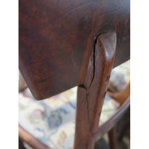 61 - A set of seven 19th century mahogany dining chairs with drop in seats including a scroll arm carver,... 