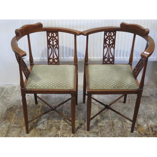 65 - A pair of Edwardian mahogany corner chairs