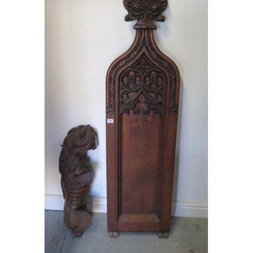 71 - An antique part carving of a rampant lion, 71cm tall and a carved oak pew end 158cm tall x 38cm wide... 
