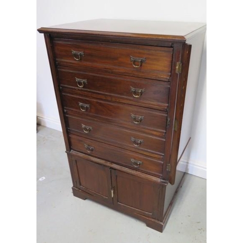 80 - An Edwardian mahogany Wellington chest cabinet with 5 drawer above 2 cupboard doors with key, 109cm ... 