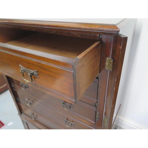 80 - An Edwardian mahogany Wellington chest cabinet with 5 drawer above 2 cupboard doors with key, 109cm ... 