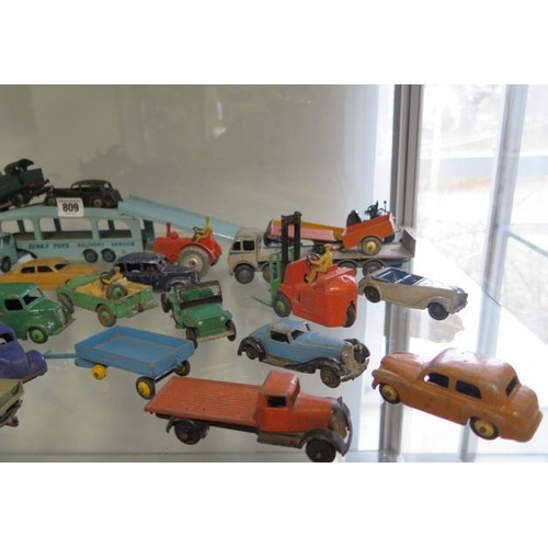 809 - A collection of approximately 40 diecast Dinky and other vehicles, all play worn, but original paint... 