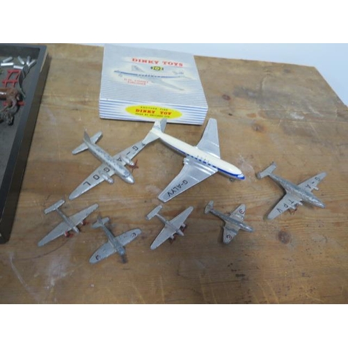 810 - 7 Dinky aeroplanes, one boxed, and a collection of lead figures etc, and a box for a Britains 155mm ... 