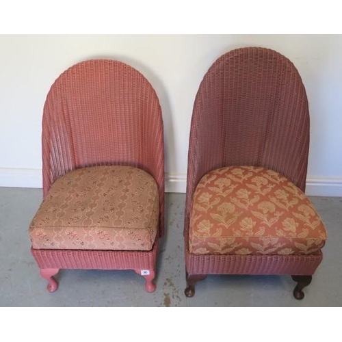 90 - Two Lloyd Loom chairs with upholstered seats, 83cm and 77cm tall