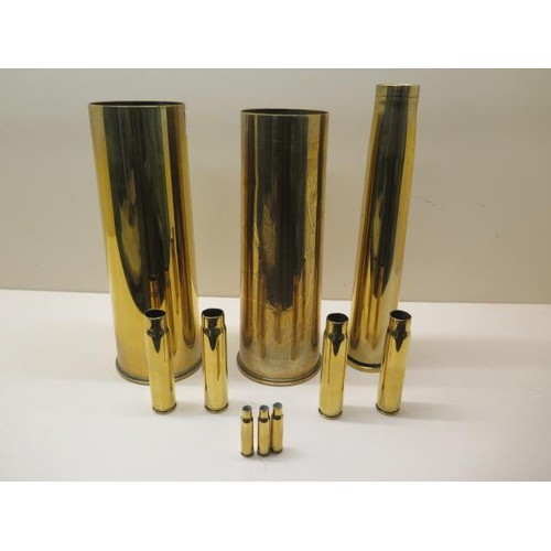 926 - 10 brass shell cases, tallest 31cm