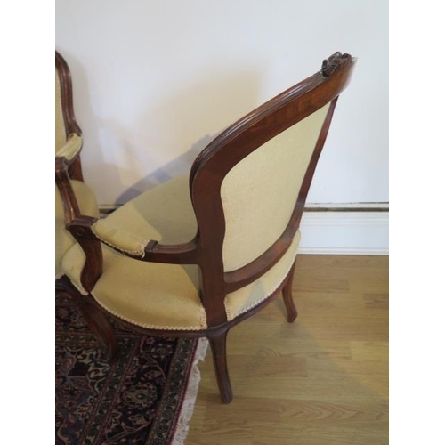 103 - A pair of carved beechwood upholstered elbow chairs, 85cm tall x 57cm wide