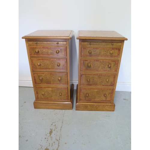 14 - A pair of new burr oak bedside chests, each with a slide above four drawers, made by a local craftsm... 