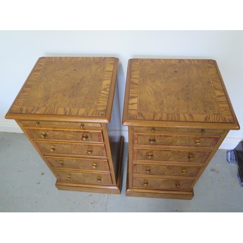 14 - A pair of new burr oak bedside chests, each with a slide above four drawers, made by a local craftsm... 