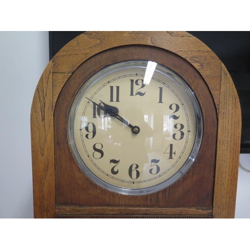 157 - An 8 day oak case clock with Westminster chimes and exposed pendulum, running order, chimes may need... 