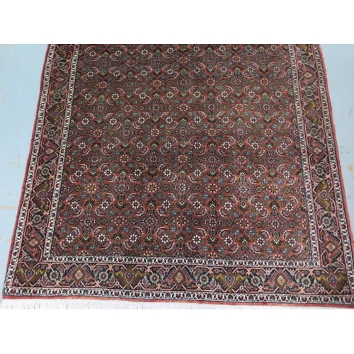 190 - A hand knotted woollen Bijar rug, 1.70cm x 1.20cm, generally good