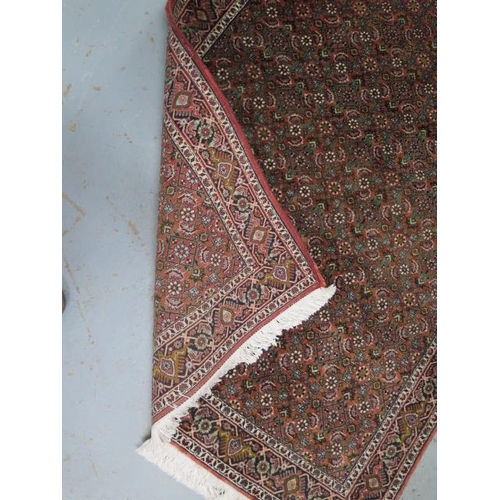 190 - A hand knotted woollen Bijar rug, 1.70cm x 1.20cm, generally good