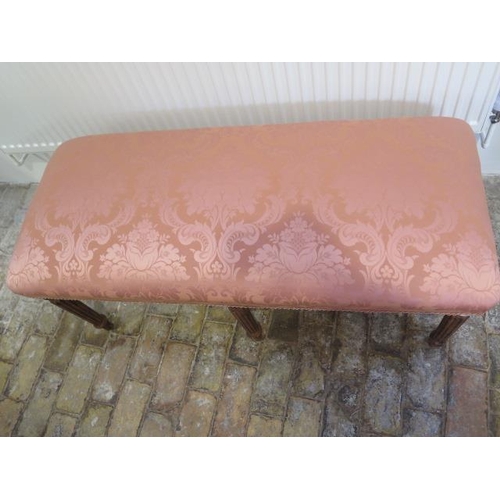 2 - An upholstered window stool on six turned reeded legs, 54cm tall x 116cm x 49cm, in good condition