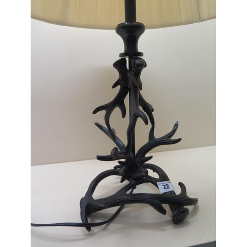 22 - A Stags horn design table lamp with shade, 64cm tall