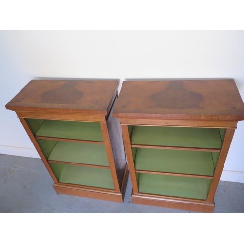 23 - A pair of new walnut bookcases with adjustable shelves and painted interior, made by a local craftsm... 