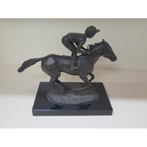 307 - A David Cornell bronze jockey and racehorse, dated 1985, 20cm tall, on a black marble base in good c... 