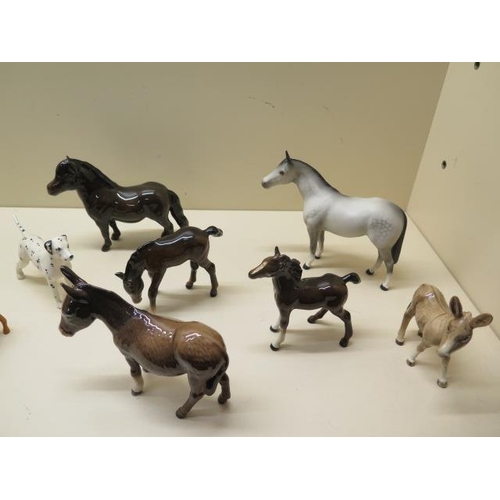 327 - A collection of 13 Beswick horses, foals, ponies, donkeys and a dog, all good