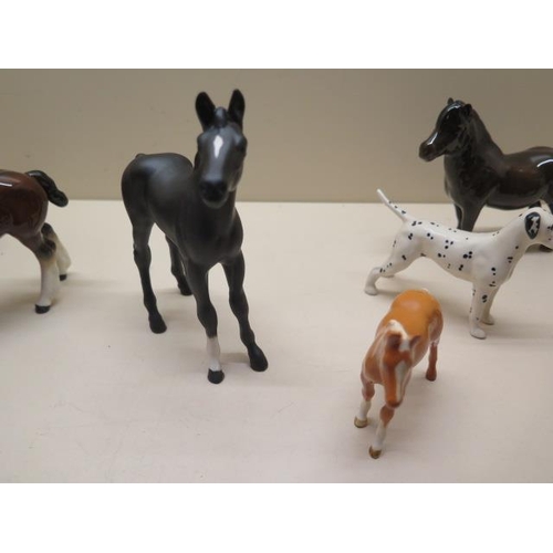 327 - A collection of 13 Beswick horses, foals, ponies, donkeys and a dog, all good