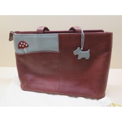 330 - A Radley Toadstool hand bag with dust cover, 34cm wide, in good condition