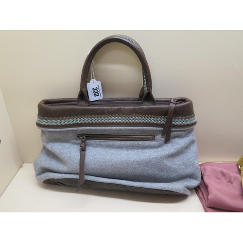 332 - A Radley stripped hand bag, 36cm wide, with dust cover and a Radley fabric handbag, both generally g... 