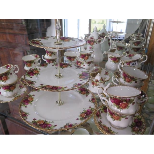 344 - A 6 setting Royal Albert Country Rose tea / coffee set, with miniature teapot missing one coffee sau... 